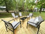 Spacious deck overlooking the backyard has great outdoor furniture
